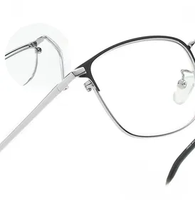 Macro view of reinforced metal hinge and screw detail on semi-rimless glasses frame