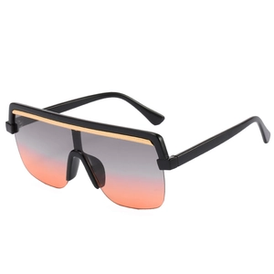 Oversized shield sunglasses with black frame, gold bridge and grey-to-pink gradient lenses