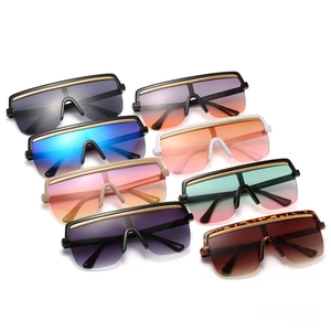 Oversized one-piece shield sunglasses in diverse colors with sleek top metal bar accents
