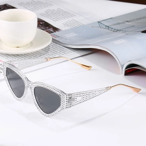 Luxury cat-eye sunglasses with rhinestone frames and metal temples for women