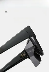 Macro detail of matte black temple hinge and 8087 model specs on oversized sunglasses