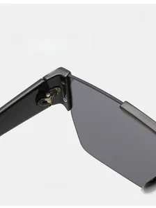 Close-up of durable metal hinge on black oversized square sunglasses for women and men