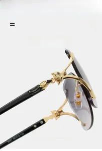 Close-up of golden leopard head detail on rimless sunglasses with gradient lenses