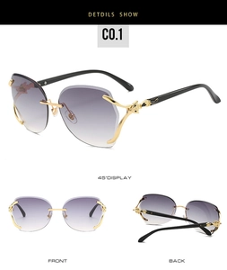 Detail view of purple gradient rimless sunglasses with gold leopard head metal accents