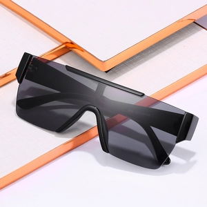 Oversized square shield sunglasses with black frame and grey lenses on geometric stand