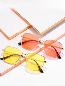 Detail of retro square metal sunglasses with orange and yellow gradient lenses
