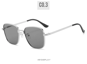 Detail shot of vintage square metal sunglasses featuring silver frames and grey lenses