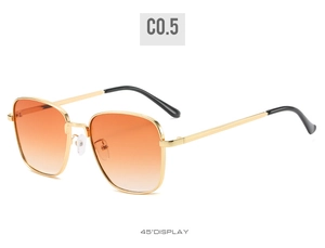 Detail shot of vintage square sunglasses with gold metal frame and orange gradient lenses