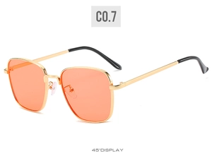 Detail view of gold square metal frame sunglasses with orange lenses at a 45-degree angle