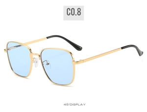 Detail of vintage square sunglasses with golden metal frame and blue translucent lenses