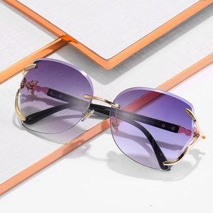 Elegant rimless fox-head sunglasses with purple gradient lenses and gold metal frames