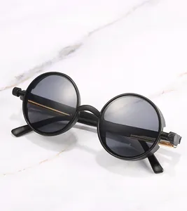 Detail of steampunk sunglasses with metallic spring temples on marble background
