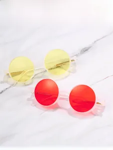 Detail of steampunk sunglasses with metal spring legs and vibrant colored round lenses