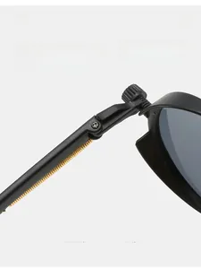 Detail of the durable metal hinge and golden wavy pattern on these steampunk sunglasses