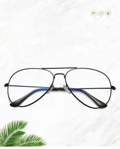 Detail of pilot style anti-blue light glasses with black metal frames on marble background