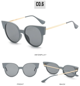 Trois angles de lunettes de soleil œil de chat, monture mate grise et branches dorées