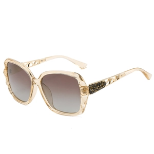 Classic oversized women's sunglasses with champagne gold frames and gradient brown lenses