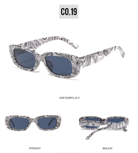 Three perspectives of trendy rectangle sunglasses with marble texture and dark lenses