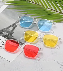 Detail of classic square sunglasses with transparent frames in blue, yellow, and red lenses