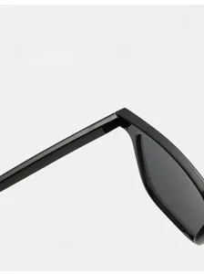 Detailed macro view of durable metal hinges on classic retro square frame sunglasses