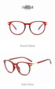 Detail of red cat-eye glasses frame featuring gold metal floral temple engraving