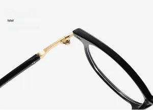 Detail of durable gold metal hinge on black cat-eye glasses frame with CE mark