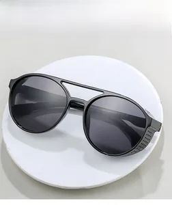 Detail view of steampunk sunglasses with double bridge and side shield on gray background