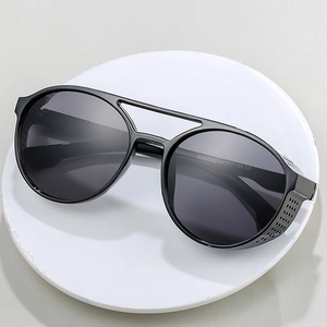 Steampunk black pilot sunglasses with retro side shields on a white circular display base
