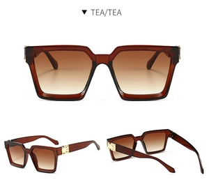 Detailansicht der teebraunen quadratischen Sonnenbrille mit goldenen Metallakzenten