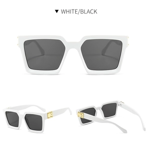 Detailsicht der weißen quadratischen Sonnenbrille mit goldenen Scharnieren und Gläsern