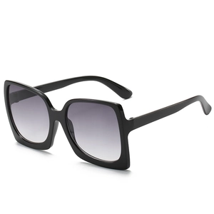 Classic oversized square sunglasses with shiny black frame and grey gradient lenses