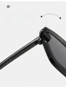 Close-up of durable metal hinge on black square sunglasses with specifications