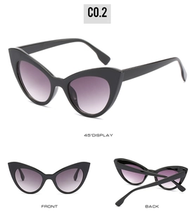 Vue triple de lunettes œil-de-chat monture noire et verres dégradés violets