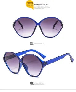Detail of oval sunglasses with transparent royal blue frame and purple gradient lenses
