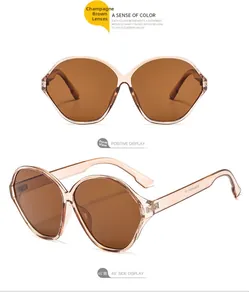 Detail view of oval champagne frames with brown lenses and durable metal hinges