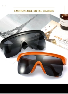Détail des lunettes de soleil masque oversize stylées avec montures et verres colorés