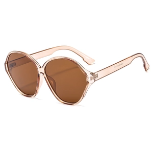 Oval champagne transparent resin sunglasses with oversized dark brown UV lenses