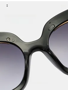 Close-up of comfortable integrated nose pads on trendy black oversized sunglasses