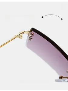Detail of the golden metal hinge and purple gradient rimless square lens of these sunglasses