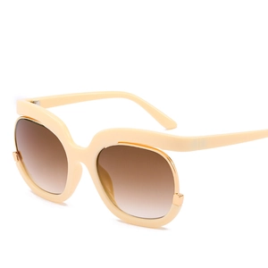 Modern oversized cream sunglasses with wavy frames and gradient brown lenses