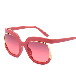 Fashionable oversized women's sunglasses with red wavy frames and pink gradient lenses