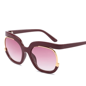 Burgundy oversized sunglasses with gradient pink lenses and gold metal details