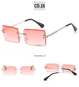 Detailed close-up of rimless square sunglasses with pink gradient lenses and silver temples