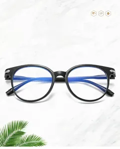 Detail of black round anti-blue light glasses frame on white marble background
