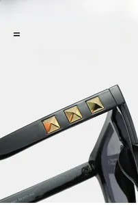 Close-up of black sunglasses arm featuring golden pyramid studs and model number 8261