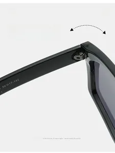 Detail shot of sturdy metal hinges on black trendy oversized sunglasses frames