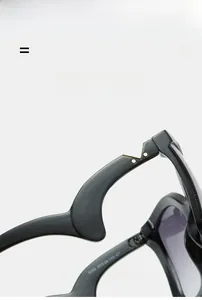 Detail of black sunglasses featuring triangle metal accents and hinge specifications