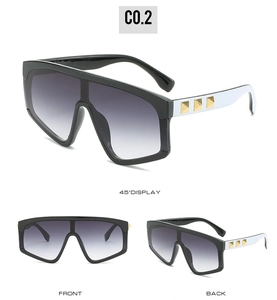 Multi-angle views of oversized shield sunglasses with gold pyramid studs on temples