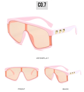 Detailed views of pink oversized sunglasses with orange lenses and golden metal studs