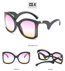 Detailed views of oversized sunglasses with black frames and pink-yellow gradient lenses